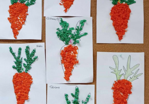 Prace plastyczne dzieci przestawiające kontur marchewki wyklejony kuleczkami bibuły.