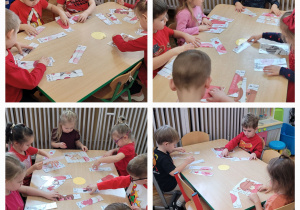 Dzieci z grupy słoneczka siedzą przy stolikach i układają puzzle z walentynkowymi obrazkami.